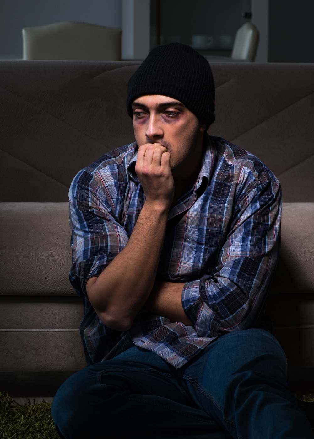 Man sitting alone in distress for marijuana addiction treatment page