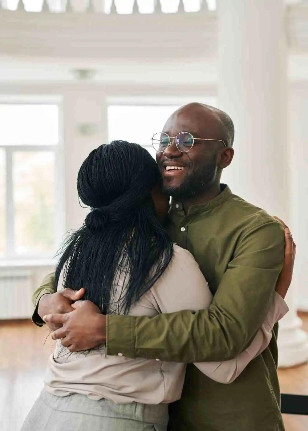 Two people hugging showing support during heroin addiction recovery