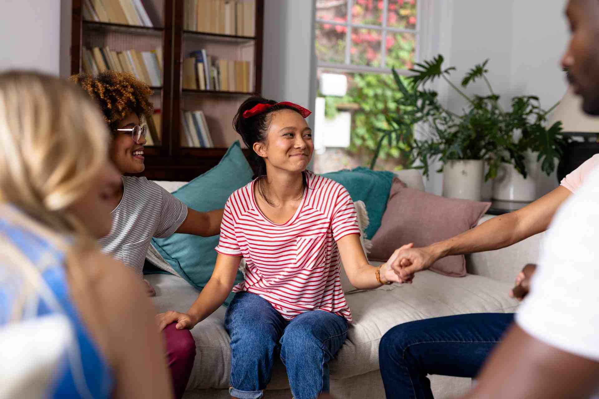 Person participating in a supportive group therapy session during methamphetamine recovery