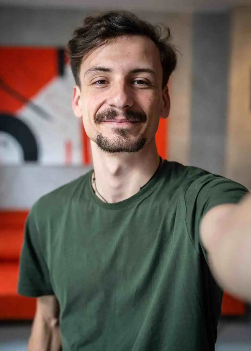 Young man smiling taking selfie showing confidence and recovery progress